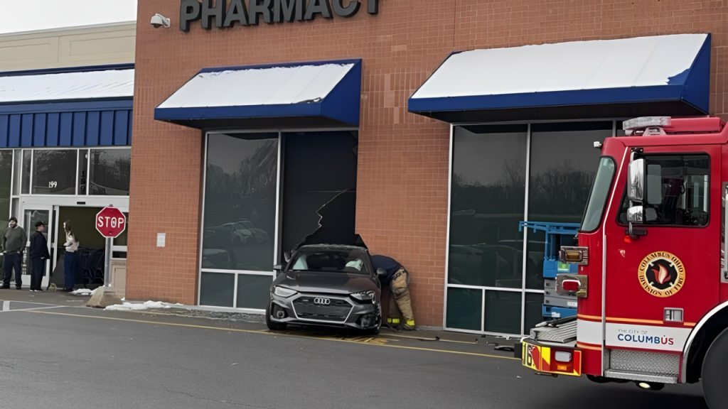 Shocking Crash: Woman in Hospital After Vehicle Hits Building in Columbus!